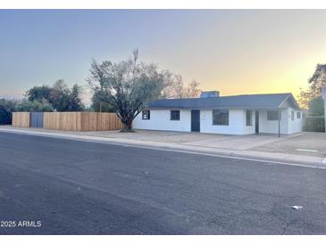 Charming single story home showcasing a clean, freshly painted exterior and a well-maintained front yard at 7420 N 58Th Ave, Glendale, AZ 85301
