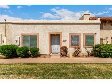 Charming single-story home featuring a stucco facade, well-maintained landscaping, and a welcoming front entrance at 3109 W Loma Ln, Phoenix, AZ 85051