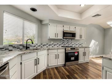 Updated kitchen with granite countertops and stainless steel appliances at 3832 N Gallatin --, Mesa, AZ 85215