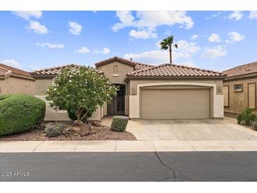 Charming single-story home with tile roof, desert landscaping, and a two-car garage at 4517 E Sourwood Dr, Gilbert, AZ 85298