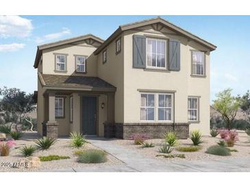 Charming two-story home with neutral stucco, stone accents, covered entry, and manicured front yard at 14594 W Sand Hills Rd, Surprise, AZ 85387