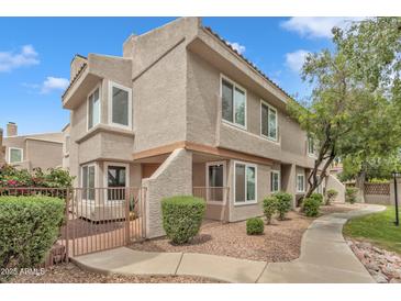 Charming two-story townhome with well-maintained landscaping and desert-style rock ground cover at 2834 S Extension Rd # 1079, Mesa, AZ 85210