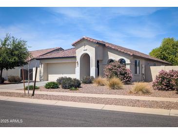 Charming single-story home featuring desert landscaping, a two-car garage, and a covered entry way at 4094 E Los Altos Dr, Gilbert, AZ 85297