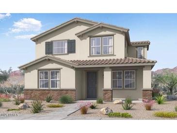 Charming two-story home with neutral paint, shuttered windows, brick accents, and tile roof at 14596 W Sand Hills Rd, Surprise, AZ 85387
