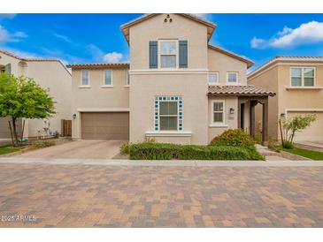 Charming two-story home with neutral stucco, a brown garage door, and inviting curb appeal at 17160 N 9Th Pl, Phoenix, AZ 85022