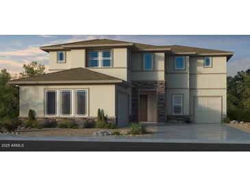 Beautiful two-story home featuring stone accents, manicured landscaping and a two car garage at 17827 W Medlock Dr, Litchfield Park, AZ 85340