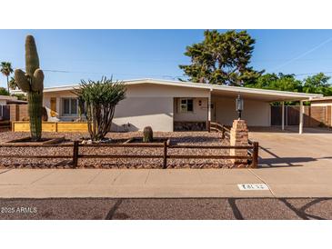 Charming single-story home featuring desert landscaping and a cozy, covered porch entry at 3632 E Poinsettia Dr, Phoenix, AZ 85028