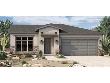 Charming single-story home with a two-car garage and desert landscaping at 5619 N 193Rd Ave, Litchfield Park, AZ 85340