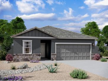 Charming single-story home features stone accents, a neutral color palette, and a two-car garage at 13240 E Verbina Ln, Florence, AZ 85132