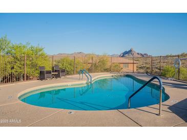 Beautiful pool with mountain views and comfortable seating area perfect for relaxation and outdoor enjoyment at 16336 E Ridgeline Dr, Fountain Hills, AZ 85268