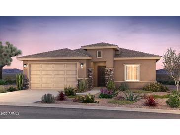 Charming single-story home with a two-car garage, stone accents, and a beautifully landscaped front yard at 17758 W Getty Dr, Goodyear, AZ 85338
