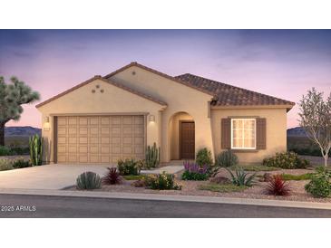 Charming single-story home featuring a tile roof, desert landscaping, and a two-car garage at 17764 W Getty Dr, Goodyear, AZ 85338