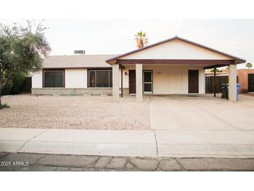 Charming single-story home with a spacious carport and low maintenance desert landscaping at 2738 E Libby St, Phoenix, AZ 85032