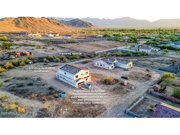 Exterior view of a home with spray foam insulation, 2nd story deck and mountain views at 3835 W Fox Rd, Laveen, AZ 85339
