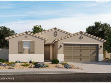 Charming single-story home features a two-car garage, neutral stucco, and a beautifully landscaped front yard at 15995 W Honeysuckle Dr, Surprise, AZ 85387