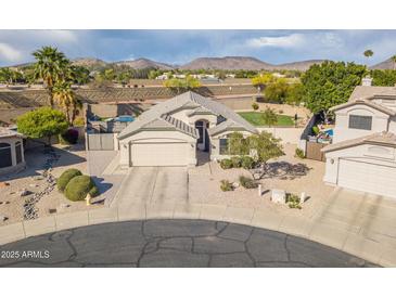 Charming home with desert landscaping, mountain views and a two car garage at 20017 N 65Th Dr, Glendale, AZ 85308