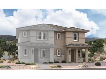 A modern two-story home with stone accents, a covered entry, and desert landscaping creates curb appeal at 2830 N Evergreen St, Buckeye, AZ 85396