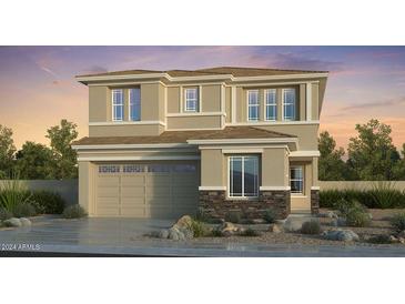 This is a charming two-story home with a stone accent, a two car garage and desert landscaping at 7670 W Crabapple Dr, Peoria, AZ 85383
