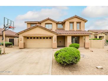 Stunning two-story home with a spacious driveway, desert landscaping, and an attached two-car garage at 10219 E Le Marche Dr, Scottsdale, AZ 85255