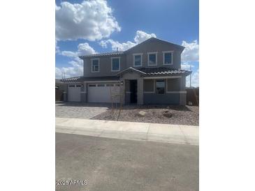 Charming two-story home featuring a spacious two car garage and neutral gray paint at 12393 W Marguerite Ave, Avondale, AZ 85323
