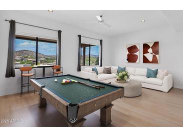Spacious game room with pool table, natural light, and mountain views at 16219 E Ridgeline Dr, Fountain Hills, AZ 85268