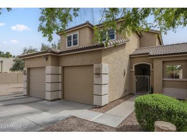 Two-story stucco home featuring a tile roof, 3-car garage, and gated front porch at 3795 W Mercury Way, Chandler, AZ 85226