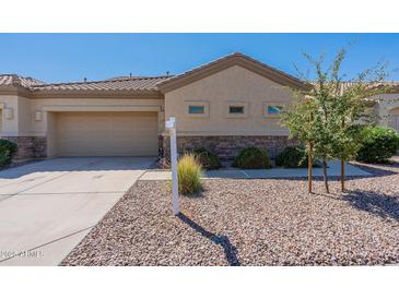 Charming single-story home with a well-maintained desert landscape and a neutral-toned exterior at 1539 E Brenda Dr, Casa Grande, AZ 85122