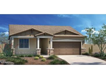 Charming single-story home featuring a two-car garage, well-maintained lawn and neutral color palette at 19022 W Rose Ln, Waddell, AZ 85355