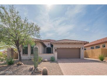 Charming single-story home featuring desert landscaping, a brick driveway, and a tile roof at 1904 N Steele --, Mesa, AZ 85207