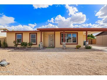 Charming single-story home with desert landscaping and a covered front porch at 2331 W Hartford Ave, Phoenix, AZ 85023