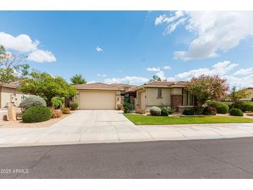 Charming single-Gathering home with manicured landscaping and a spacious two-car garage at 4313 N 161St Ave, Goodyear, AZ 85395