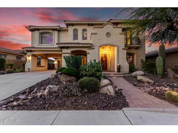 Inviting two-story home with desert landscaping and a brick walkway leading to the front entrance at 13336 W Via Caballo Blanco --, Peoria, AZ 85383