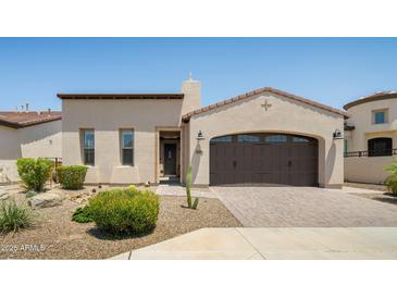 Inviting single-story home featuring a desert landscaped front yard and attached two-car garage at 156 E Leverenz Ave, Queen Creek, AZ 85140