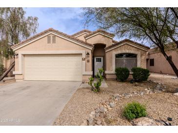 Charming single Gathering home featuring a neutral paint palette, landscaping, and attached two car garage at 34195 N Alison Dr, San Tan Valley, AZ 85144