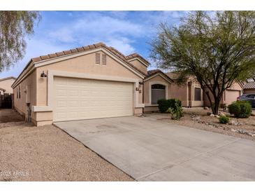 Charming single-story home features a well-kept front yard and attached garage at 34195 N Alison Dr, San Tan Valley, AZ 85144