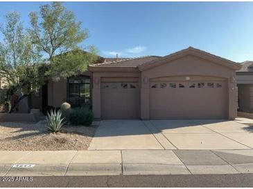 Attractive single-story home featuring a well-kept yard and a neutral-toned exterior at 4843 E Estevan Rd, Phoenix, AZ 85054