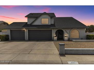 Charming single-Gathering home featuring a three-car garage and well-maintained front yard at 6237 W Altadena Ave, Glendale, AZ 85304