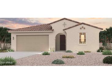 Charming single-story home featuring a terracotta tile roof, neutral stucco, and desert landscaping at 18007 W Camino De Oro --, Surprise, AZ 85387
