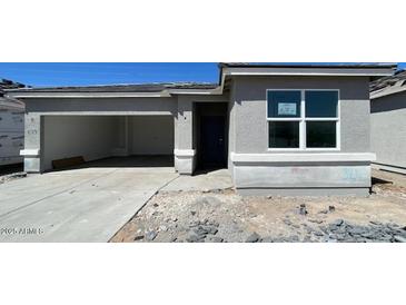 Charming single-story home featuring a convenient attached two-car garage and a modern design at 5016 S 106Th Ln, Tolleson, AZ 85353