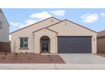 Charming single-story home with a dark gray garage door, landscaped front yard, and classic Southwestern architecture at 5201 S 251St Dr, Buckeye, AZ 85326