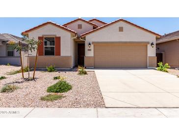 Charming single-story home with a two-car garage, low-maintenance landscaping, and a welcoming front entrance at 7417 E Hackamore Ln, San Tan Valley, AZ 85143