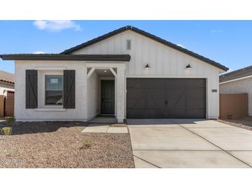 Charming single-story home featuring a two-car garage and stylish modern farmhouse design at 16575 N Lunar St, Maricopa, AZ 85138