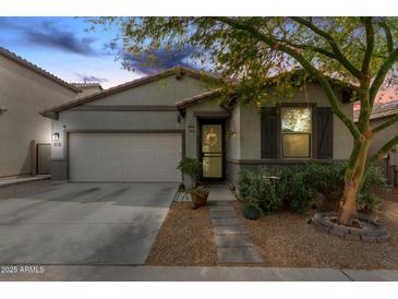 Charming single-story home features a well-manicured front yard, a two-car garage, and a welcoming entrance at 3219 W Pollack St, Phoenix, AZ 85041