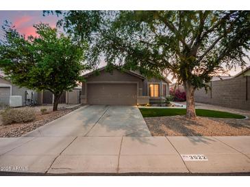 Charming single-story home with a well-manicured lawn and a two-car garage at 3922 N 125Th Dr, Avondale, AZ 85392