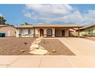 Charming single-story home featuring desert landscaping and covered parking in a suburban neighborhood at 508 W Pampa Ave, Mesa, AZ 85210