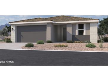 Charming home with a neutral color palette, well-maintained landscaping, and a convenient two-car garage at 7707 W Avenida Del Rey --, Peoria, AZ 85383