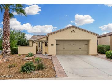 Charming single-story home with a well-manicured yard and a two-car garage at 13051 W Black Hill Rd, Peoria, AZ 85383