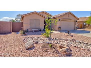 Charming single-Gathering home with a well-maintained desert-landscaped front yard at 1385 E Martha Dr, Casa Grande, AZ 85122