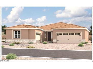 Inviting single-story home featuring a two-car garage, desert landscaping, and neutral color palette for a serene aesthetic at 4737 W Capistrano Ave, Laveen, AZ 85339