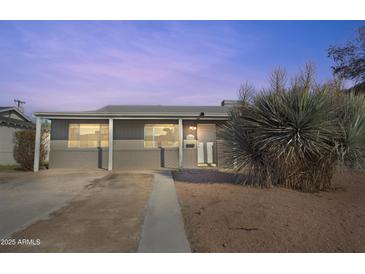 Charming single-story home featuring a covered entry and low maintenance desert landscaping in front yard at 7520 E Papago Dr, Scottsdale, AZ 85257